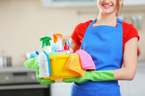 Professional carpet cleaner in Hackney deep cleaning a living room carpet