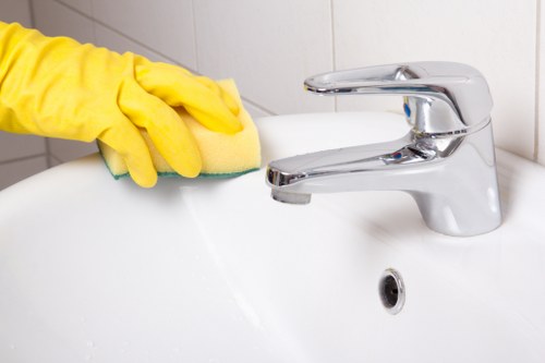 Local office cleaners disinfecting shared office surfaces in Hackney